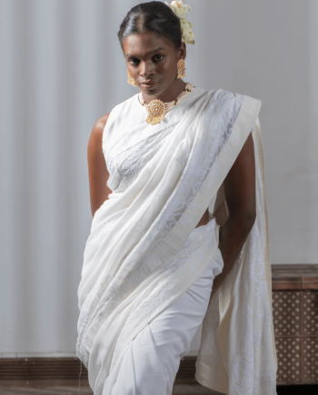 Woman wearing a Chikan Georgette White saree